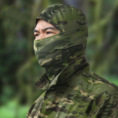Breathable Military Balaclava Helmet Liner worn by a model in camouflaged military attire.